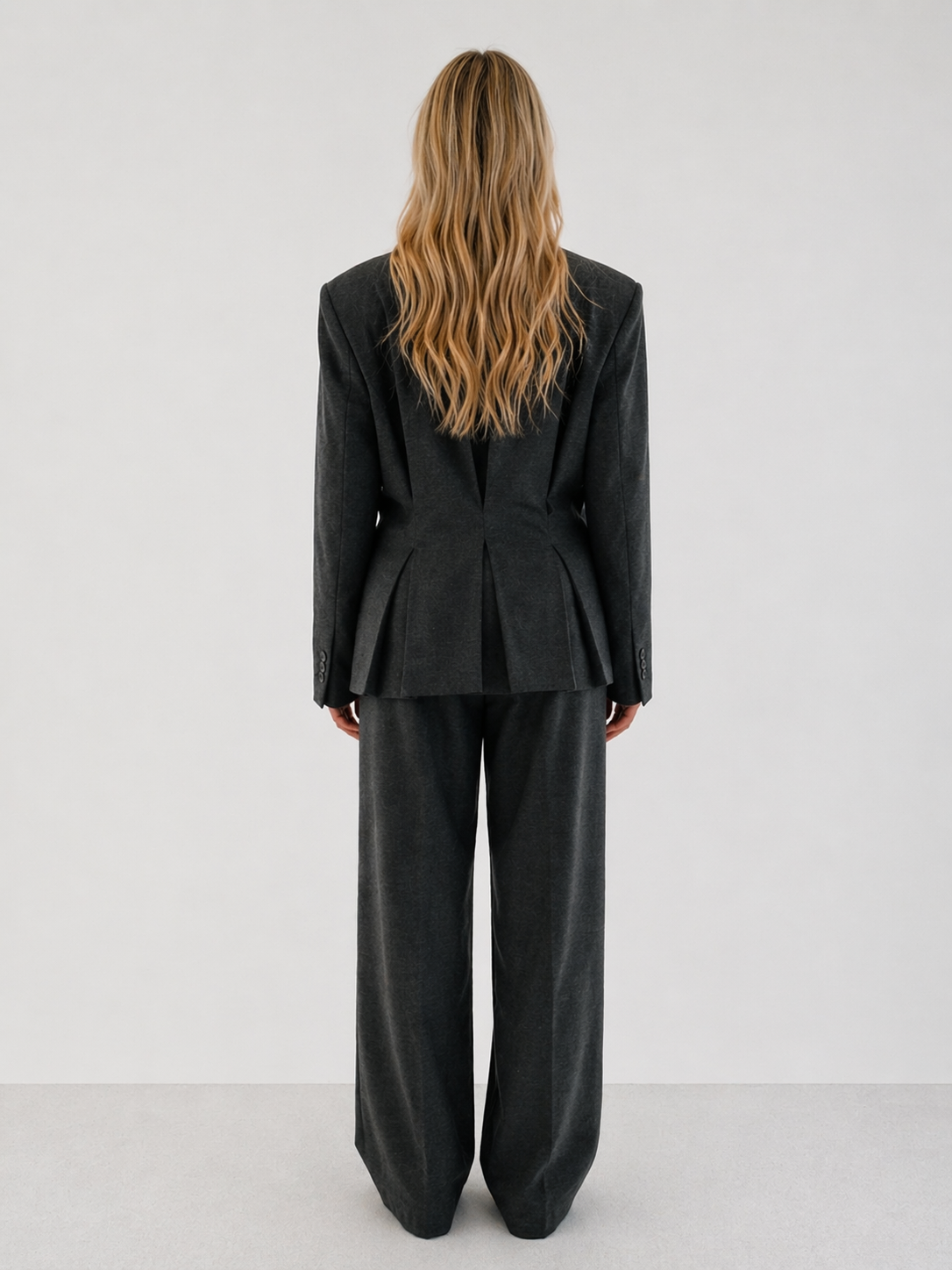 Double-breasted fitted blazer with subtle peplum silhouette